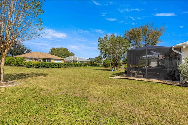 view of yard with a lanai