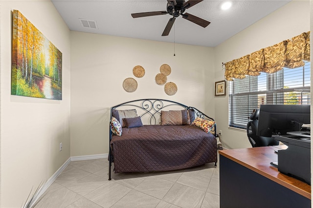 tiled bedroom with ceiling fan