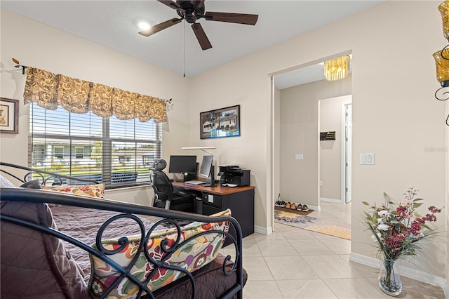 tiled bedroom with ceiling fan and a textured ceiling