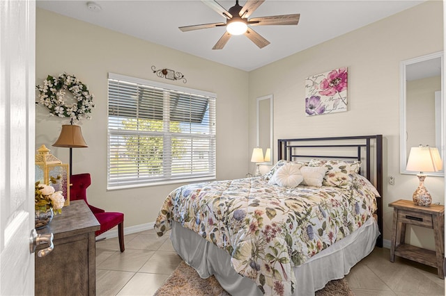 tiled bedroom with ceiling fan