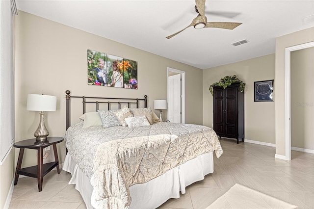 tiled bedroom with ceiling fan