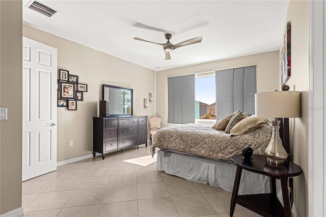 bedroom with light tile patterned flooring and ceiling fan