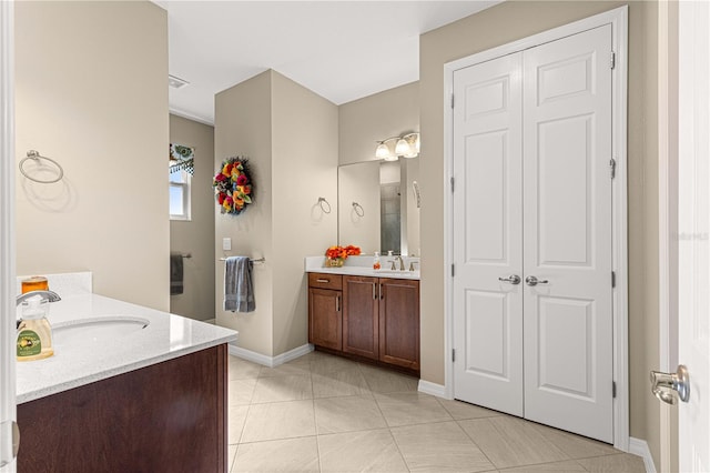 bathroom featuring vanity and tile patterned flooring