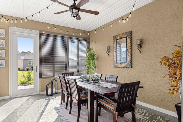 dining space featuring wood ceiling and ceiling fan