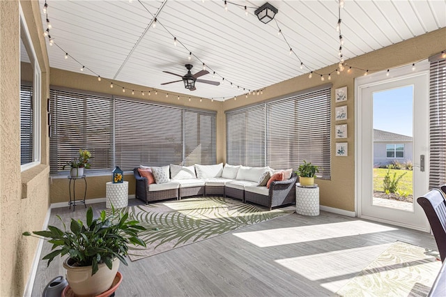 sunroom with ceiling fan