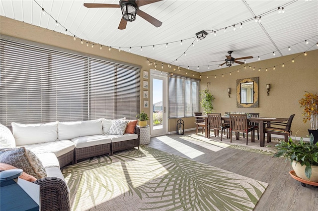 living room with ceiling fan and hardwood / wood-style floors