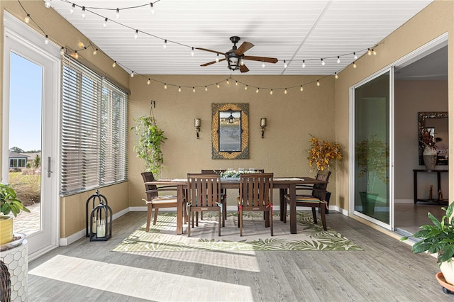 dining area featuring light hardwood / wood-style floors and ceiling fan