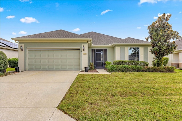 view of front facade with a front yard and a garage