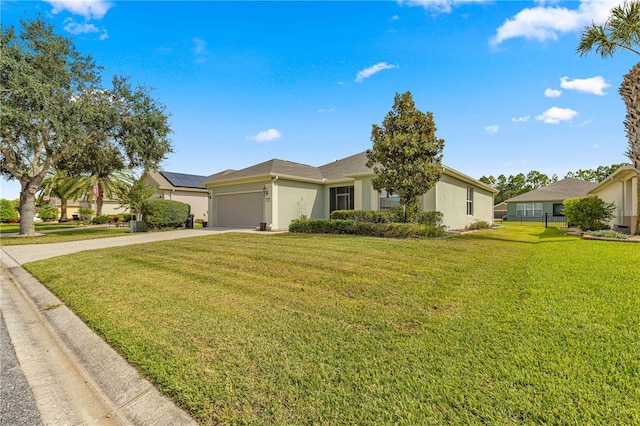 single story home with a garage and a front lawn