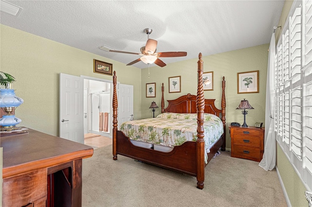 bedroom with light carpet, a textured ceiling, and ceiling fan