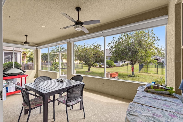 sunroom / solarium with ceiling fan