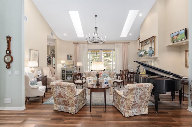 living room featuring an inviting chandelier, dark hardwood / wood-style floors, and a skylight