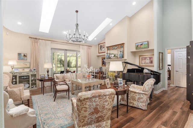 living room with a skylight, a notable chandelier, high vaulted ceiling, and dark hardwood / wood-style flooring