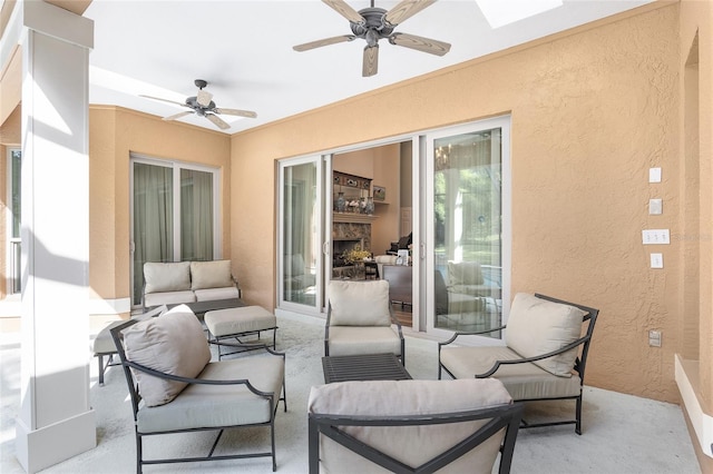 view of patio with outdoor lounge area and ceiling fan