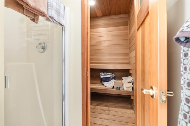 view of sauna / steam room with wood ceiling and hardwood / wood-style floors