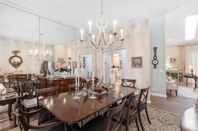 dining area with hardwood / wood-style flooring and a chandelier