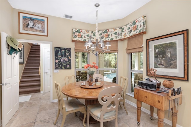 dining room with a notable chandelier