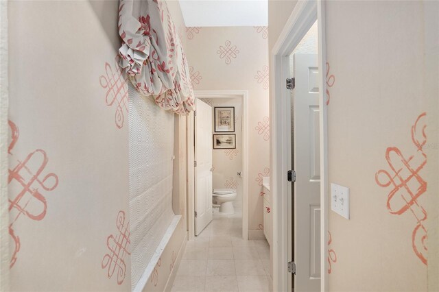 corridor featuring light tile patterned floors
