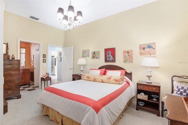 bedroom with light carpet and an inviting chandelier