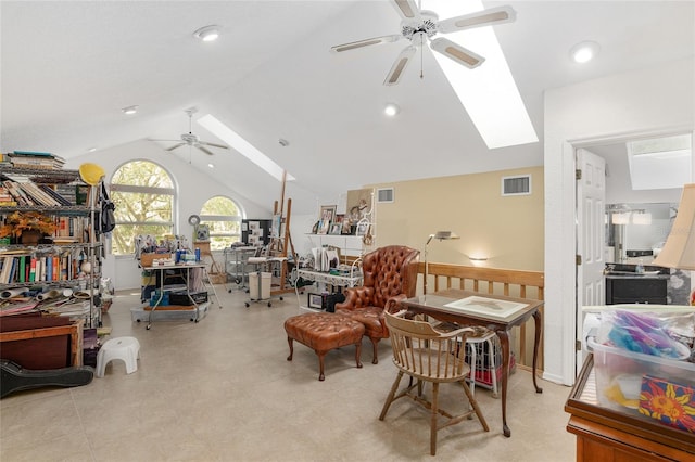 living area with lofted ceiling with skylight and ceiling fan