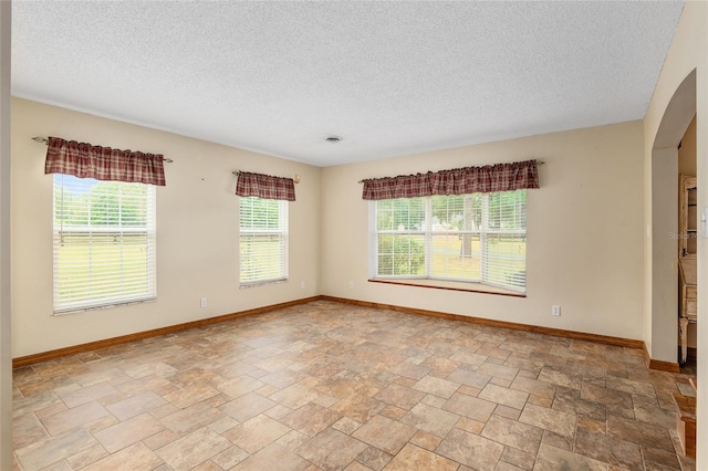 empty room with a textured ceiling