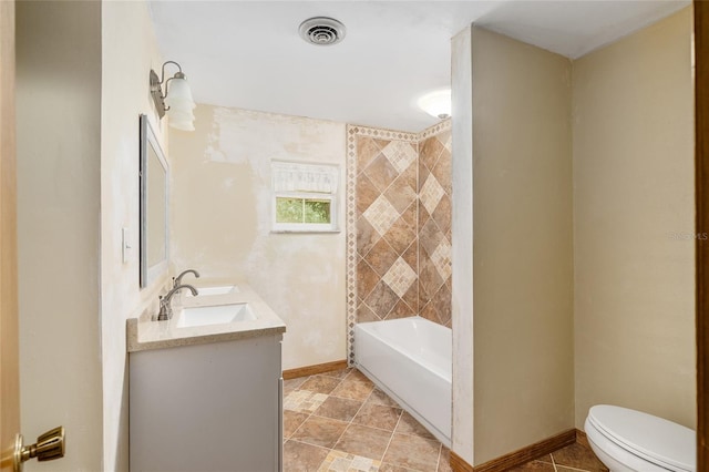 bathroom featuring toilet, vanity, and tile patterned floors