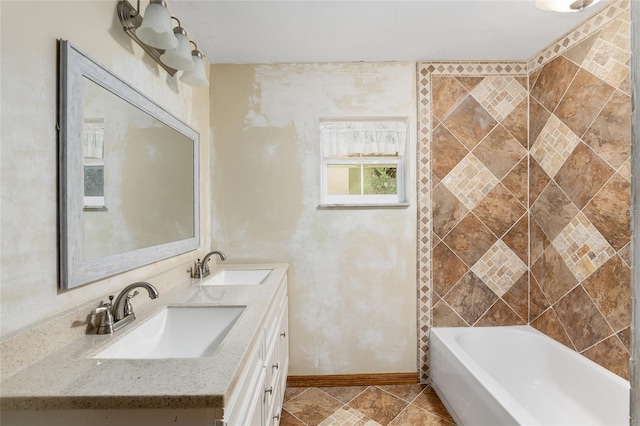 bathroom with vanity and a bath