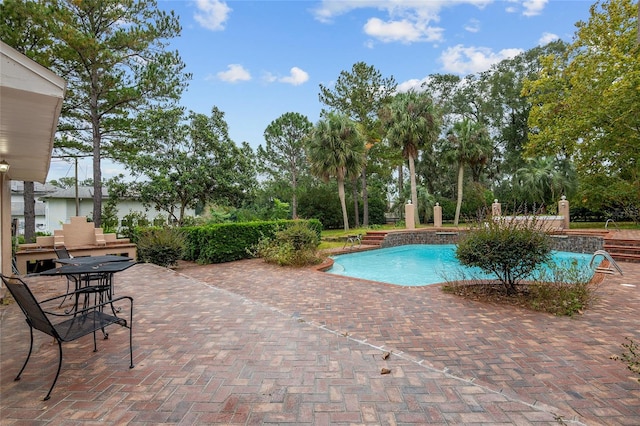 view of swimming pool featuring a patio