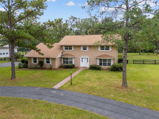 view of front of property with a front lawn