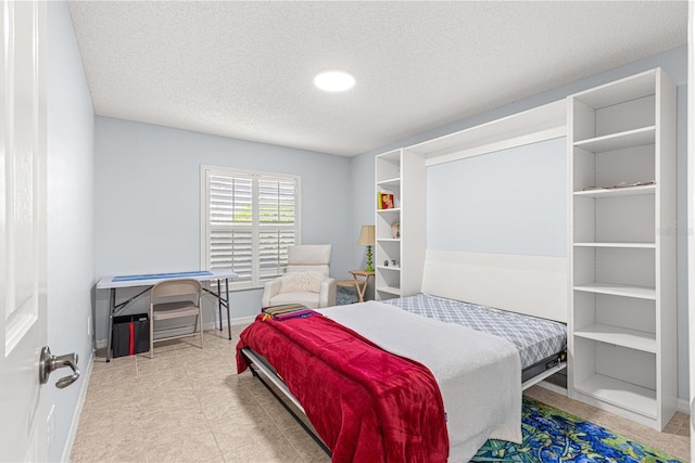 bedroom featuring a textured ceiling