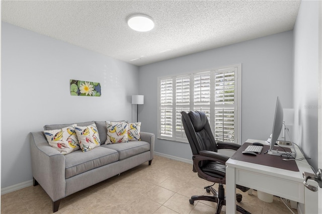 office featuring light tile patterned flooring and a textured ceiling