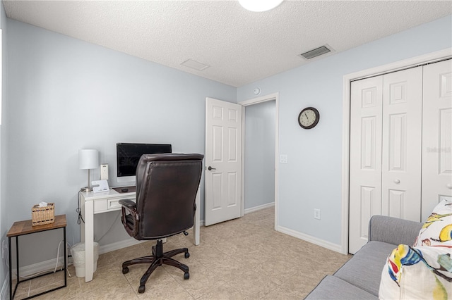 office with a textured ceiling