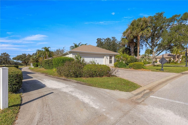 view of front of property featuring an attached garage and driveway