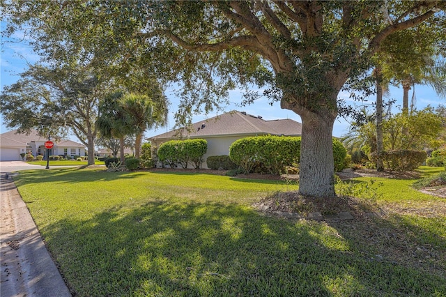 view of side of property featuring a lawn