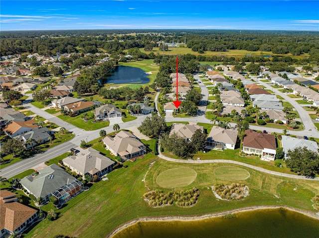 drone / aerial view with a water view, golf course view, and a residential view