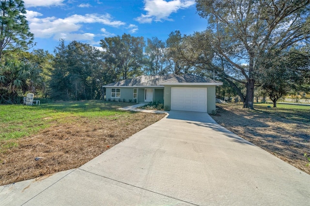 ranch-style home with a front yard and a garage