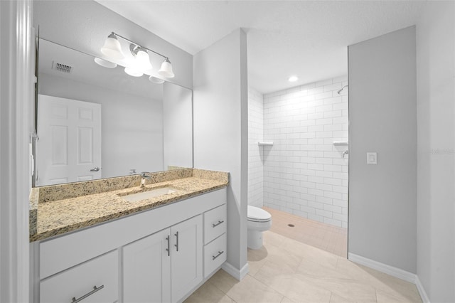 19662 SW Marine Blvd, Dunnellon, FL 34431 - full bathroom featuring vanity, a tile shower, and tile patterned floors