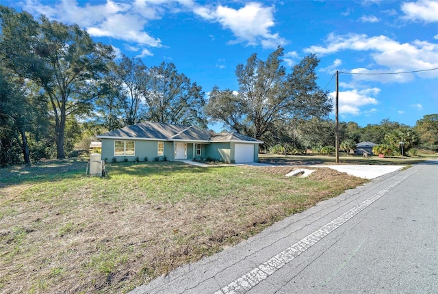 ranch-style house with a front lawn and a garage