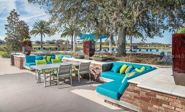 view of patio with a water view