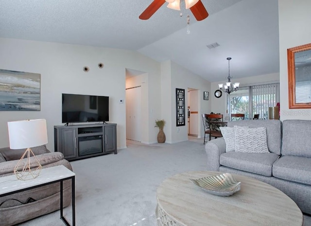 living room with lofted ceiling, a textured ceiling, light colored carpet, and ceiling fan with notable chandelier