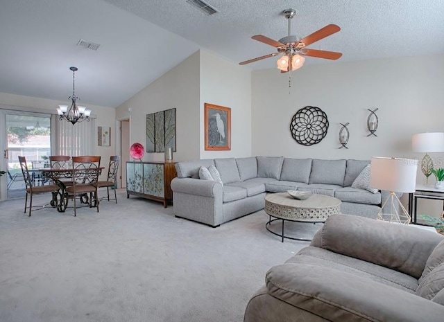 carpeted living room featuring high vaulted ceiling, a textured ceiling, and ceiling fan with notable chandelier