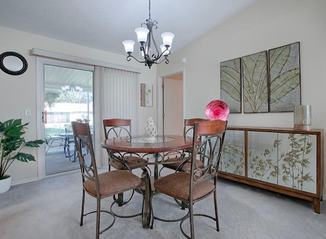 dining space with light colored carpet and an inviting chandelier