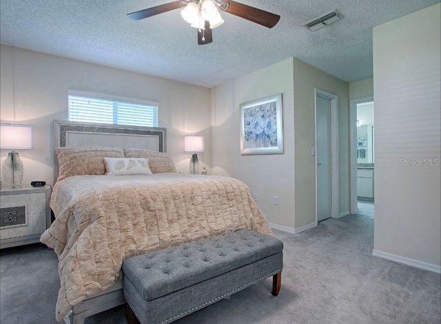 bedroom featuring a textured ceiling, carpet, and ceiling fan