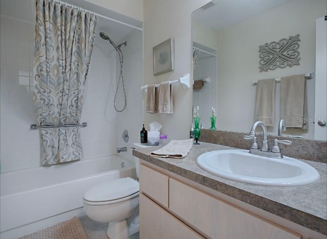 full bathroom featuring vanity, shower / tub combo with curtain, toilet, and tile patterned flooring