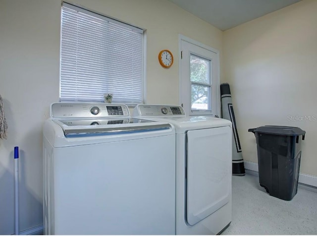 laundry room with washer and dryer