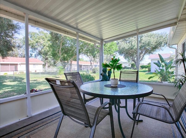 sunroom / solarium featuring a healthy amount of sunlight