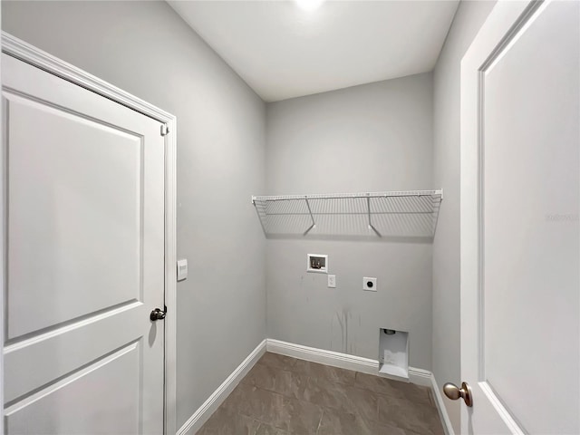 washroom featuring baseboards, laundry area, washer hookup, and electric dryer hookup