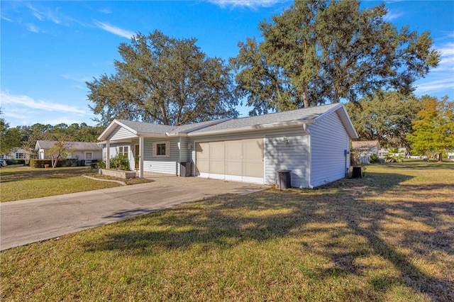 ranch-style home featuring a front yard and a garage