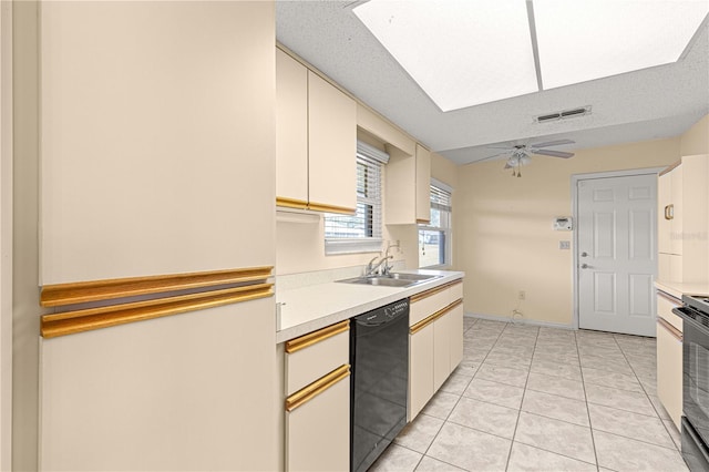 kitchen with a textured ceiling, sink, ceiling fan, and black appliances