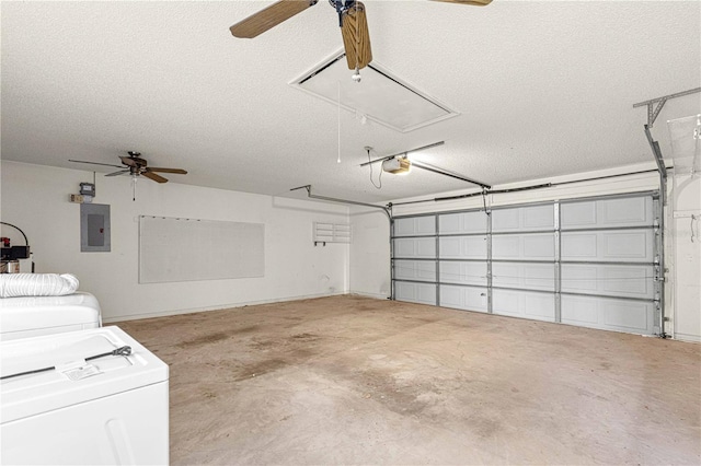 garage with washing machine and dryer, electric panel, a garage door opener, and ceiling fan